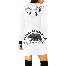 Sonoma Rebel white California Og hoodie mini dress with bear graphic and black trim. Model wears black boots.