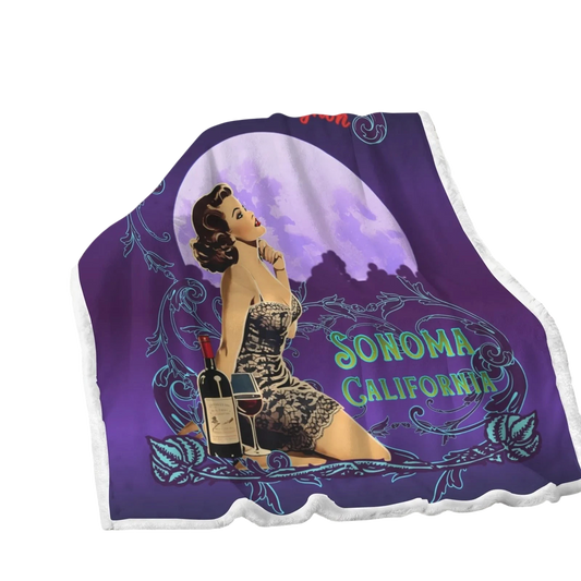 Sonoma Rebel vintage pinup fleece blanket with a woman, wine bottle, and glass under a large moon. Features "Sonoma California" text.
