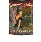 Sonoma Rebel 40"x60" tapestry featuring a retro pinup woman in a black dress, surrounded by vines and flowers, with